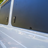 close up of a closed gullwing window on 70 series landcruiser troopy